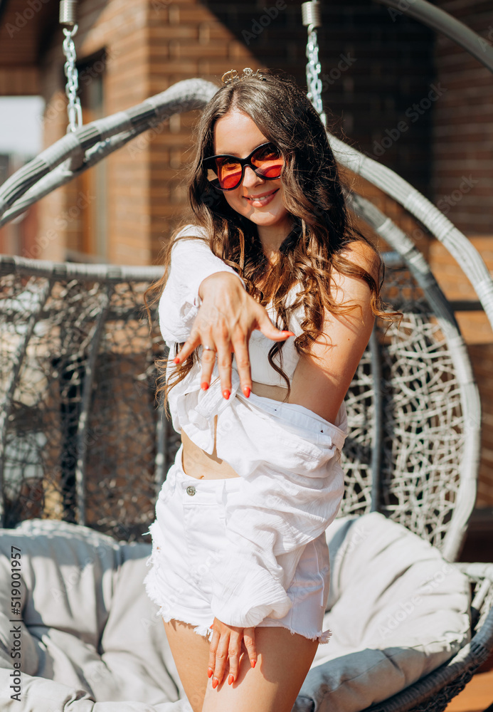 Fototapeta premium Bachelorette party. A potential bride poses, showing off her wedding ring