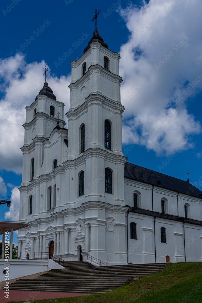 White Catholic Church on the background of blue sky