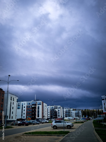 Thunderclouds over the city microdistrict