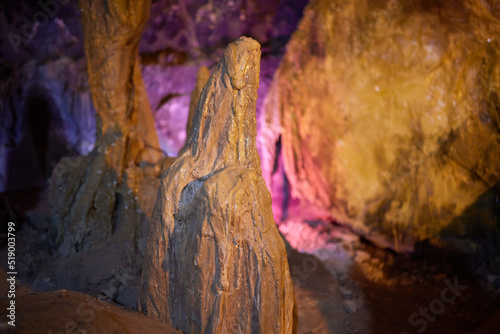 Ancient runes on the wall of the cave, weathered by time The old inscription to the descendants. photo