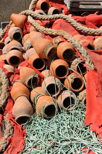 Pulperas de cerámica para la pesca del pulpo en el puerto pesquero de Rota, costa de Cádiz, España photo