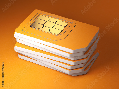 Stack of orange sim smart cards for mobile phone.