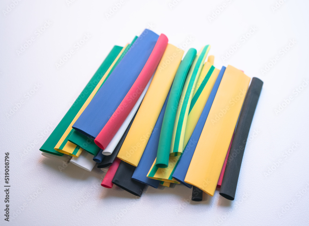 Shrink wrap on a white background.Rubber tubes for heat shrinkage on wires. Shrink wrap on a white background.Rubber tubes for heat shrinkage on wires.