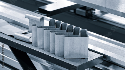 Metal products bent on a bending machine. Factory made products. Industrial concept background.
