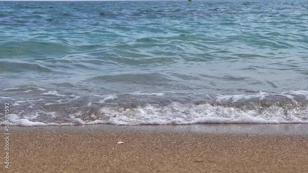 Peaceful view of the mediterranean sea with low waves on seashore Peaceful view of the mediterranean sea with low waves on seashore