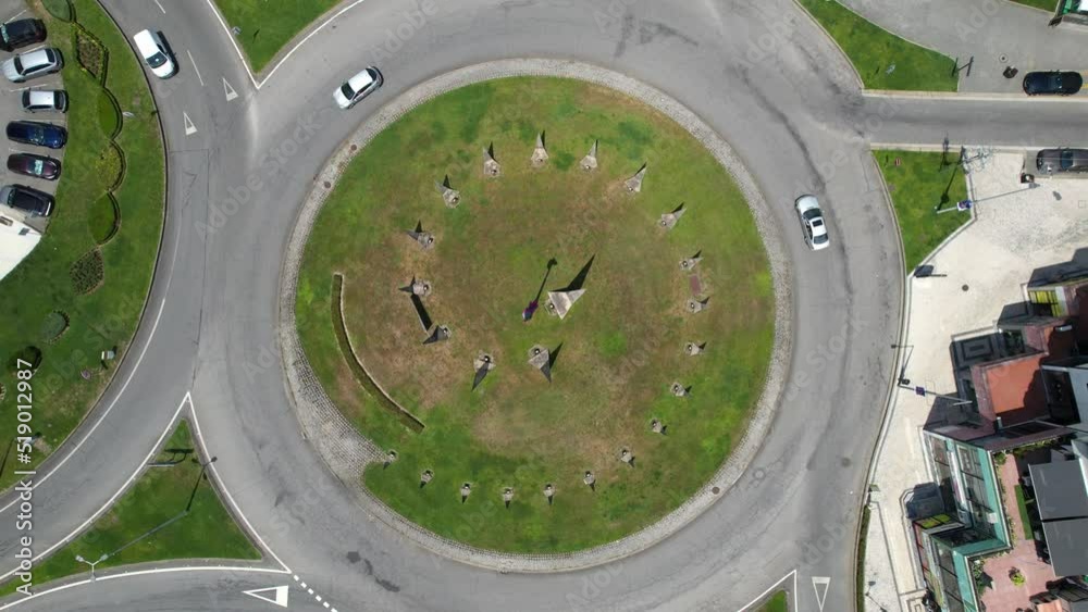 Traffic circle. Top down aerial view on a circular intersection, life city on top, car traffic on road. Urban Traffic in Portugal Traffic circle. Top down aerial view on a circular intersection, life city on top, car traffic on road. Urban Traffic in Portugal