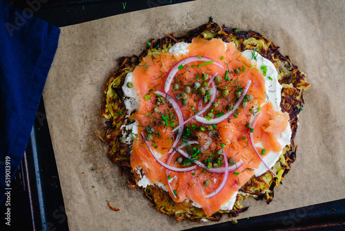 Potato Pancake Topped with Smoked Salmon and Labneh: Latkes topped with nova, capers, red onions, and fresh herbs photo