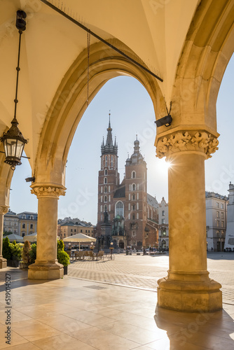 Krakow cloth hall and Saint Mary's Basilica on the main market square at sunrise in Cracow, Poland.