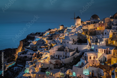 Scenic blue hour at Oia, the most typical village of Santorini and popular honeymoon destination, Greece