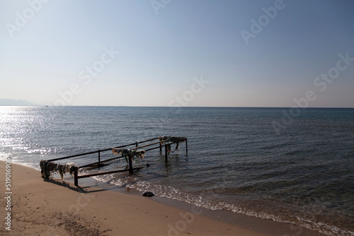 View of shattered pier on abandoned beach