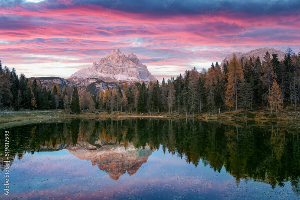 Picturesque landscape with famous lake Antorno (Lago di Antorno) in autumn Dolomites mountains. Incredible sunset in Italy Dolomites. Landscape photography