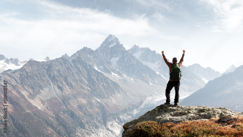 Amazing view on Monte Bianco mountains range with tourist on a foreground. Vallon de Berard Nature Preserve, Chamonix, Graian Alps. Landscape photography