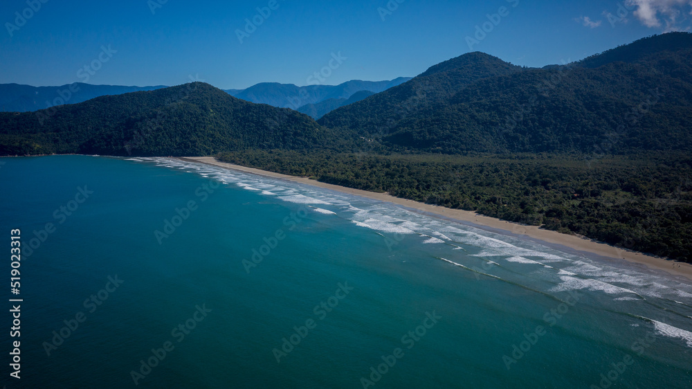 Praia da Fazenda is a tourist destination within the Serra do Mar State Park in São Paulo, Brazil. The nature of the Atlantic Forest and the beach with clear blue-green waters enchant the tourists.