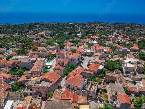 Aerial view of the beautiful seaside town Areopoli with traditional architectural buildings and stoned houses in Laconia, Greece © panosk18