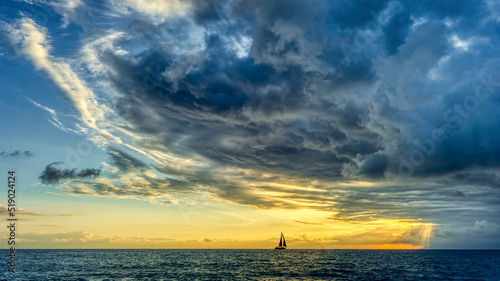 фотографія Sunset Sailboat Storm Looming Ocean Clouds