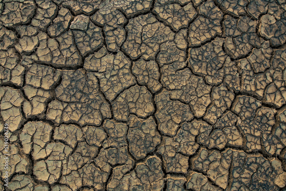 Closeup cracked earth with dry soil Closeup cracked earth with dry soil