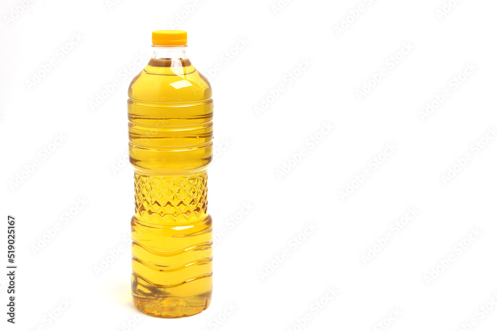 A bottle of cooking oil isolated on white background with copyspace A bottle of cooking oil isolated on white background with copyspace
