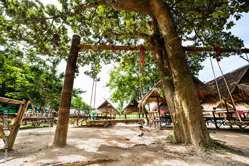Obraz na plátně Wood swing with hut beside Huay Tung Tao Lake
