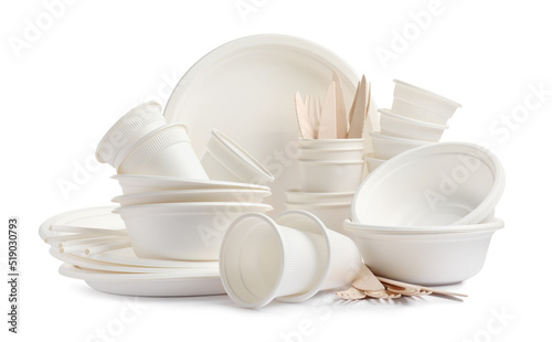 Set of disposable tableware on white background photo
