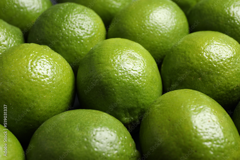 Fresh ripe green limes as background, closeup Fresh ripe green limes as background, closeup