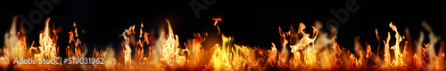 Bright fire flames on black background. Banner design © New Africa