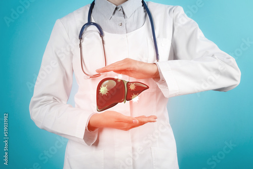 Doctor with stethoscope and illustration of unhealthy liver on light blue background. Viral hepatitis photo