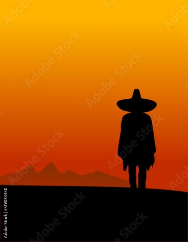 cowboy silhouette with mexican hat in orange sunset