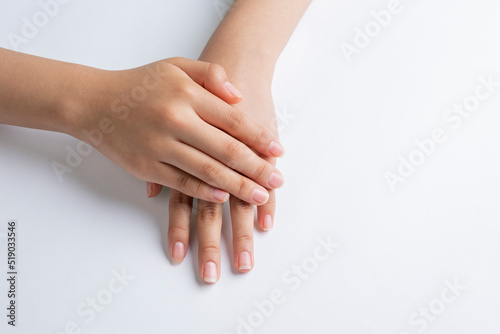 Hands of a young woman, hand and nail care with white background and copy space