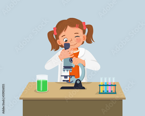cute little girl scientist looking through microscope doing research with chemical fluid in science project experiment in the laboratory