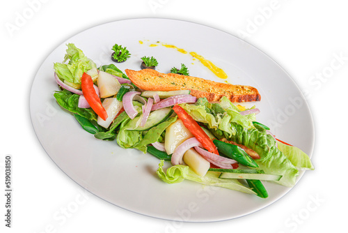 fresh green vegetable salad with lemon sauces