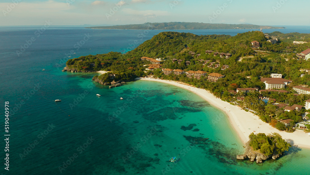 White sandy beach with tourists and hotels in Boracay Island, Philippines, aerial view. Seascape with beach on tropical island. Summer and travel vacation concept.