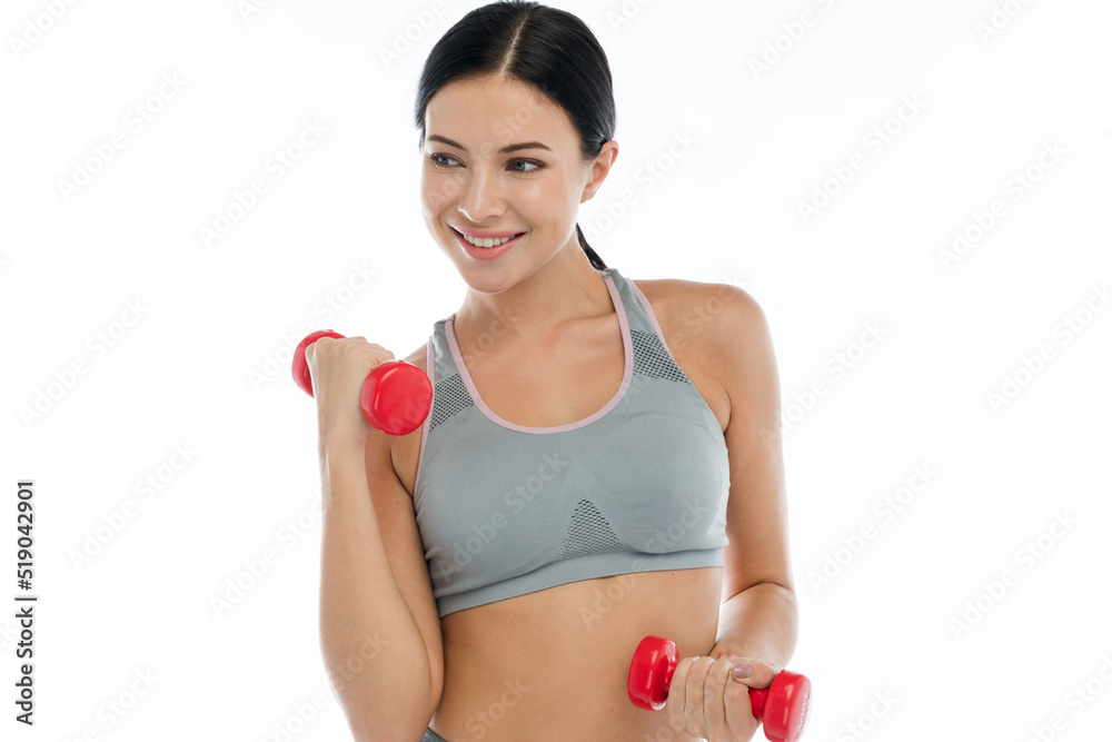 Portrait of sport slim fit strength woman workout in sportswear sitting relax and do fitness exercise with dumbbell on white background.Diet concept.Fitness and healthy lifestyle Portrait of sport slim fit strength woman workout in sportswear sitting relax and do fitness exercise with dumbbell on white background.Diet concept.Fitness and healthy lifestyle