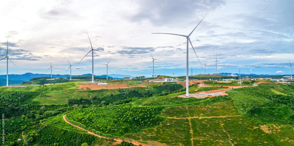 Wind turbines on the top of the hill in the morning. This is a clean energy source that does not pollute the environment to serve electricity for people