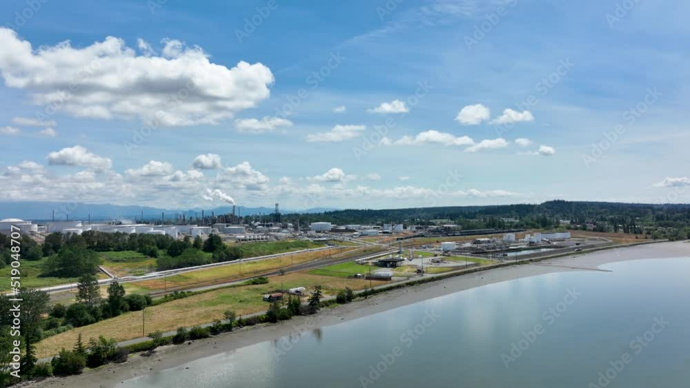 Ultra wide aerial view of an oil refinery with Fidalgo Bay in the foreground. Ultra wide aerial view of an oil refinery with Fidalgo Bay in the foreground.
