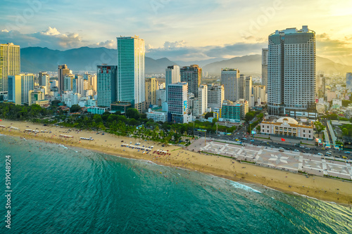 The coastal city of Nha Trang, Vietnam seen from above in the afternoon with its beautiful city and clean sandy beach attracts tourists to visit © huythoai