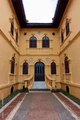 The ancient yellow building colonial architecture There are beautiful decorative stucco components  doors and windows.