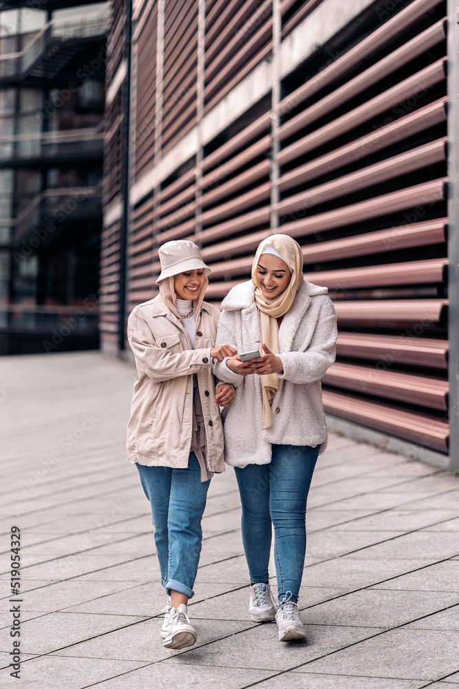 Muslim Friends Using Phone