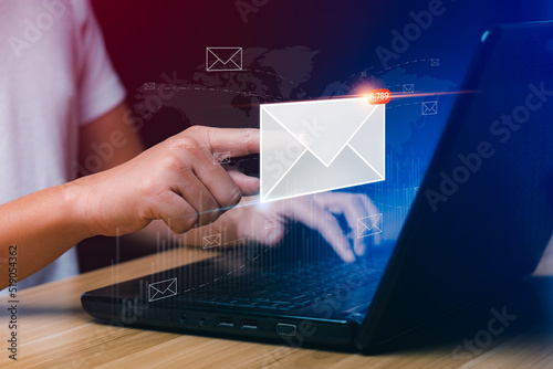 email marketing concept. Businessman using tablet surfing internet on desk with email icon, electronic mail, e-commerce. newsletter email and protect your personal information from spam mail concept