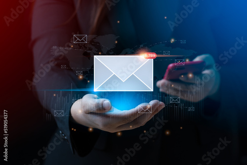 email marketing concept. businessman hand holding envelope or email icon global digital business network. electronic mail, e-commerce. newsletter email, Sending data, access to information