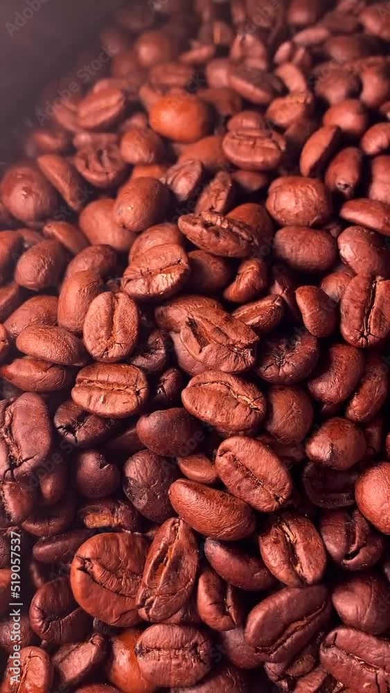 Close up of coffee grinder, grinding freshly roasted make beans into a powder Close up of coffee grinder, grinding freshly roasted make beans into a powder