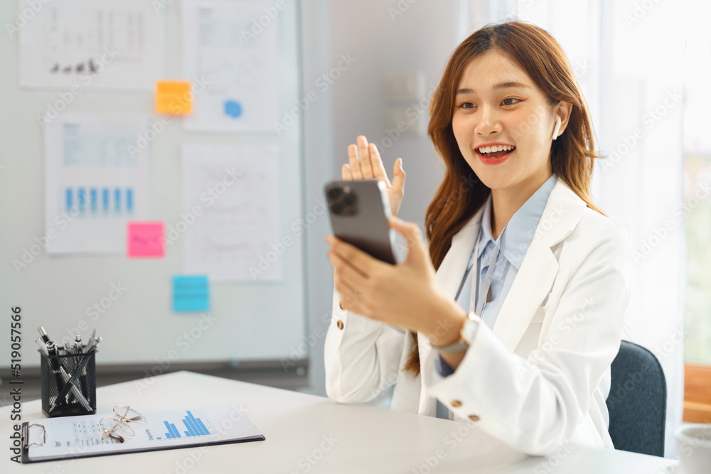 Successful business concept, Businesswoman use video call on smartphone to greeting with colleague Successful business concept, Businesswoman use video call on smartphone to greeting with colleague