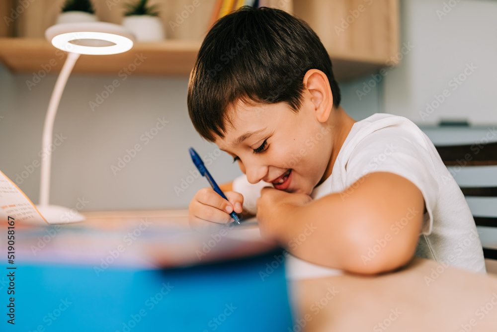 Back to School home online learning, distance lesson, education at home, technology for school. Children doing homework at exercise book writing at home Back to School home online learning, distance lesson, education at home, technology for school. Children doing homework at exercise book writing at home