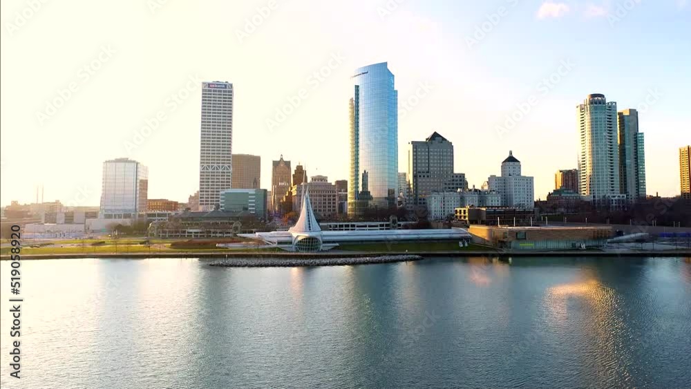 Drone shot of Milwaukee, Wisconsin off of the shoreline during sunset. Drone shot of Milwaukee, Wisconsin off of the shoreline during sunset.