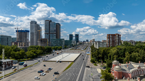 panoramic view of an automobile avenue with busy traffic in the center of Moscow on a sunny day taken from a drone © константин константи
