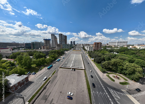 panoramic view of an automobile avenue with busy traffic in the center of Moscow on a sunny day taken from a drone
