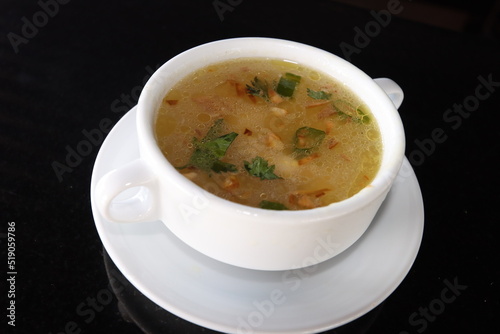 delicious and healthty chicken soup in a white bowl