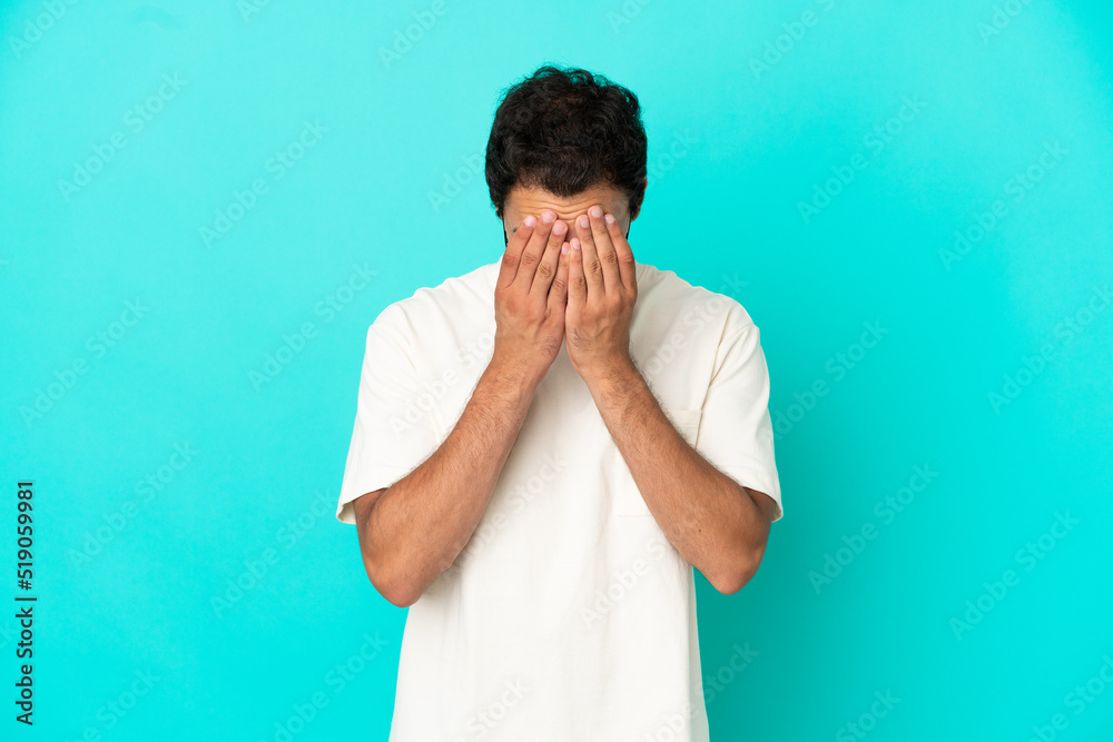Caucasian handsome man over isolated blue background with tired and sick expression Caucasian handsome man over isolated blue background with tired and sick expression