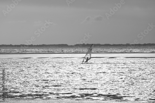 A windsurfer rides across the north sea in strong winds © Marcus