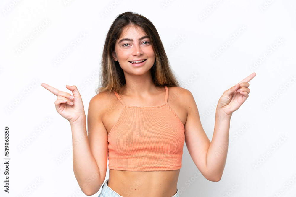 Young caucasian woman isolated on white background pointing finger to the laterals and happy Young caucasian woman isolated on white background pointing finger to the laterals and happy