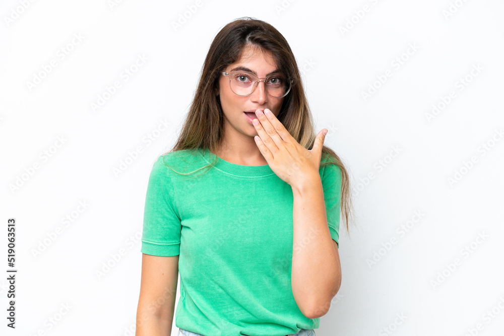 Young caucasian woman isolated on white background happy and smiling covering mouth with hand